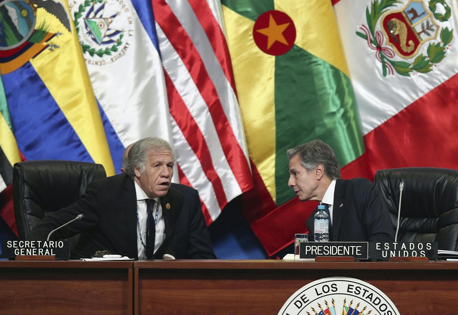 US Secretary of State Antony J. Blinken, right, talks with Secretary General of the Organization of American States (OAS) Luis Almagro at the 52nd OAS General Assembly in Lima, Peru, Thursday, October 6, 2022. (AP Photo/Guadalupe Pardo).