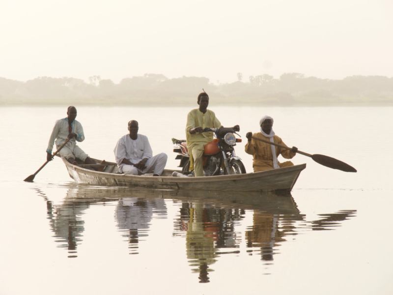 people crossing lake chad